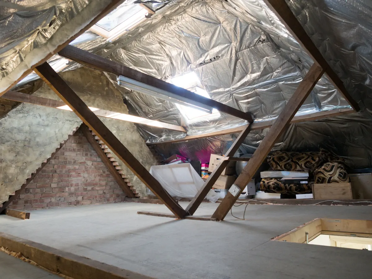 Loft space with foil-faced insulation beneath roof rafters