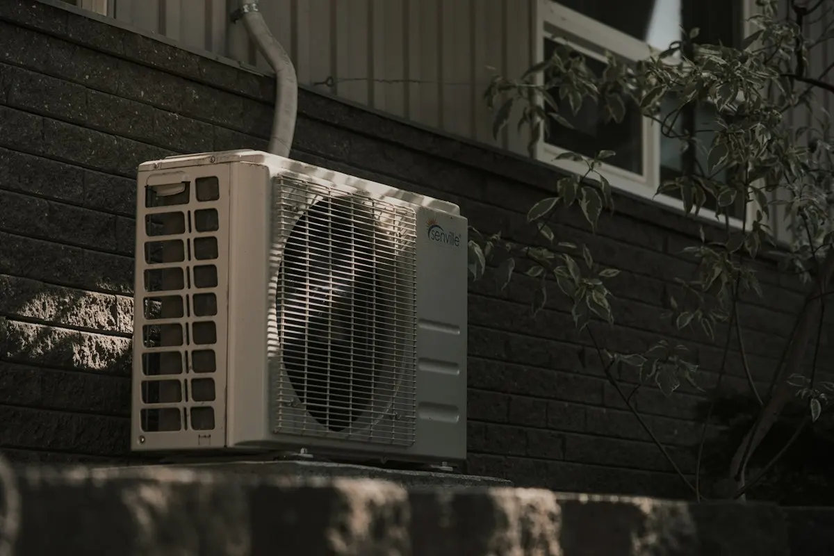 Outdoor heat-pump unit in a shaded planting area