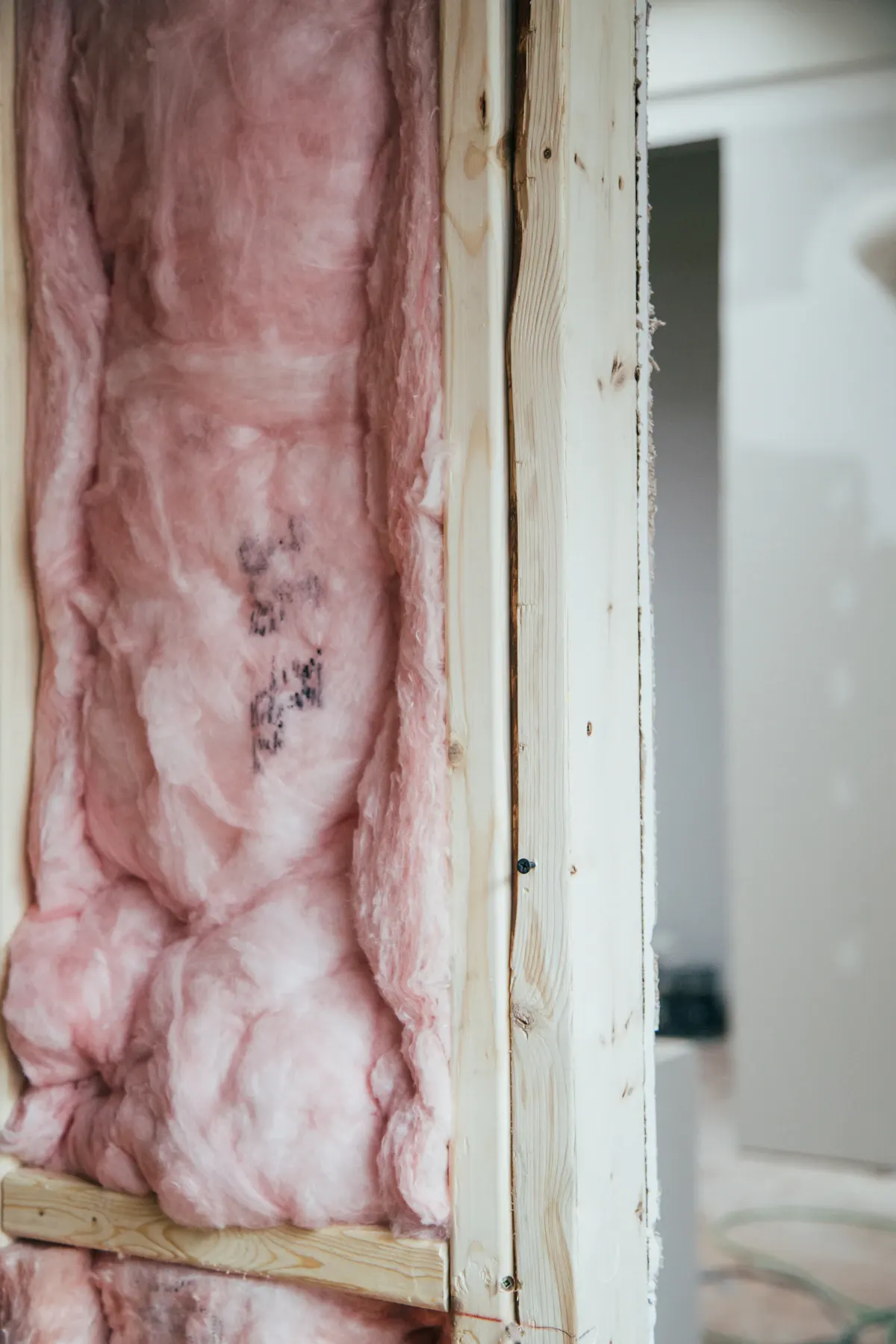 Insulation fitted around an interior doorway